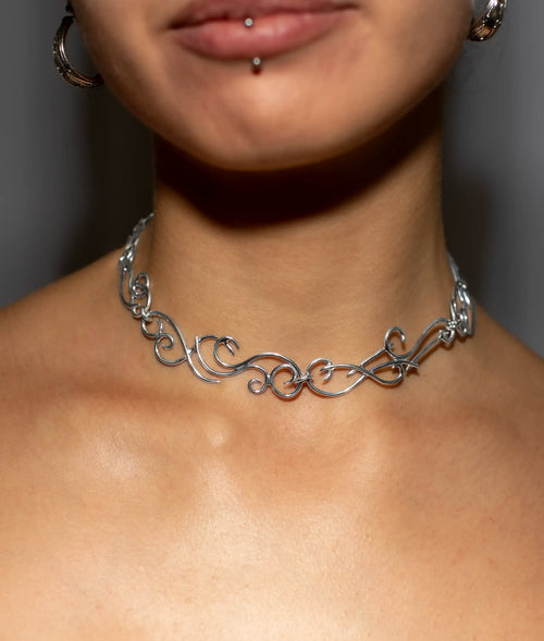 Detail of the branching sterling silver wire pattern on the necklace